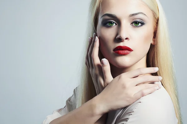 Blond woman with manicure.Beautiful girl with evening make-up