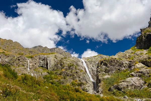 Waterfall under Ushba glacier in Mazery valleyin Georgia