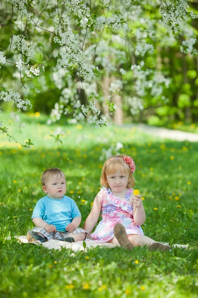 Boy and girl plays in park