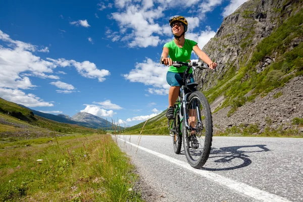 Biking in Norway against picturesque landscape