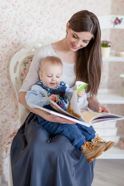 Caucasian mother and her child read a book