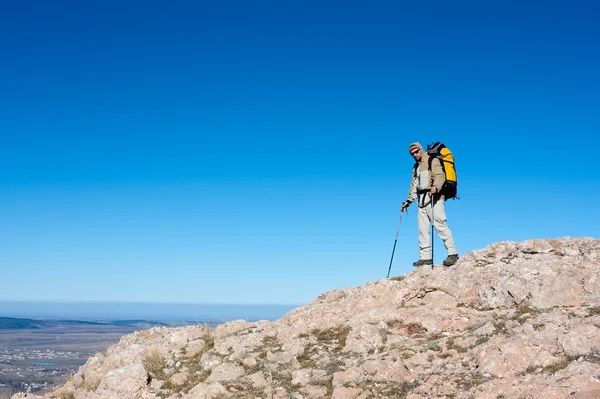 Hiker is standing on top of mountain in Crimea mountains against