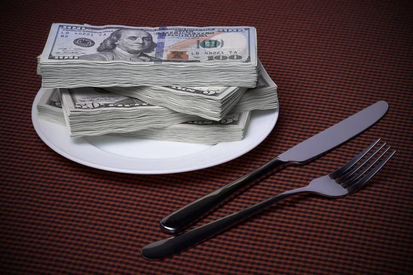 Packs of dollars on a plate
