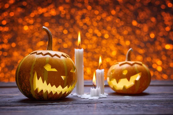 Pumpkins for Halloween and wax candles