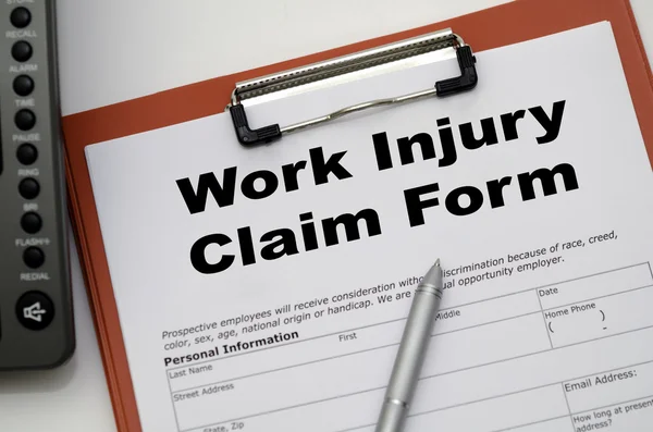 Claim form for a work injury on a desk top