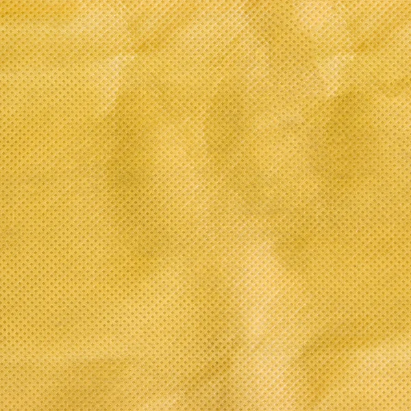 Yellow canvas with delicate striped pattern, crumpled.