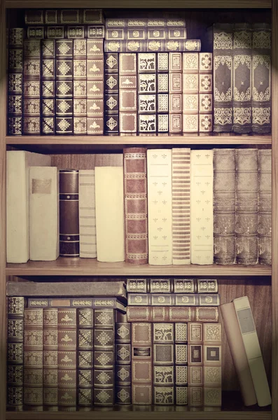 Old library, cover books on shelves