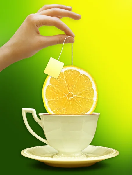 A cup of tea with a slice of lemon. Background for poster