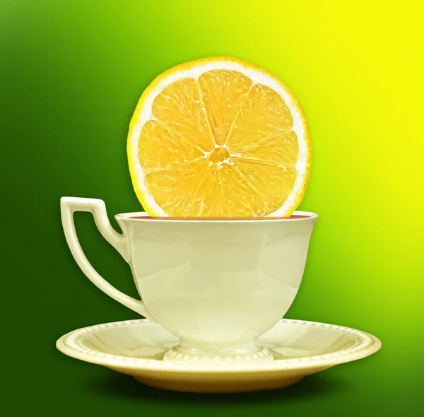 A cup of tea with a slice of lemon. Background for poster