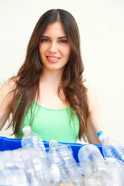 Woman holding recycling bin