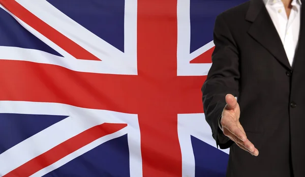 Open hand and Great Britain flag in the background