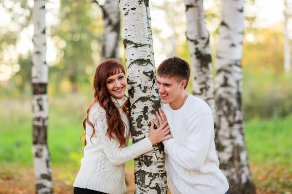 Love, happy couple in park with birch trees, summer, autumn suns