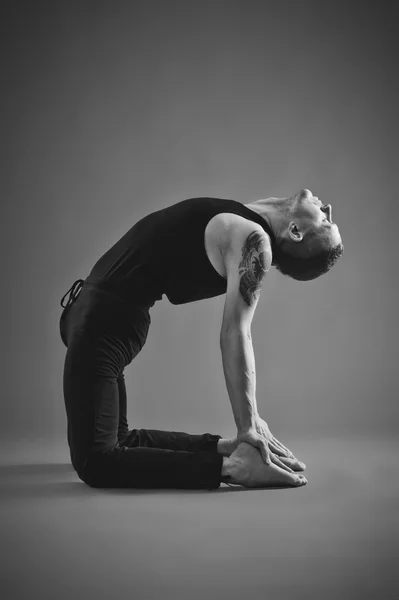 Yoga Man posing in studio
