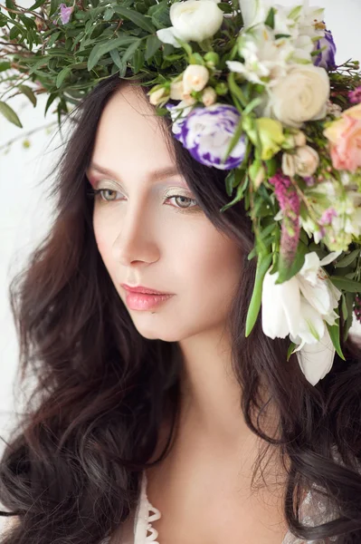 Beautiful Woman with Curly Hair, Makeup and Flowers Wreath