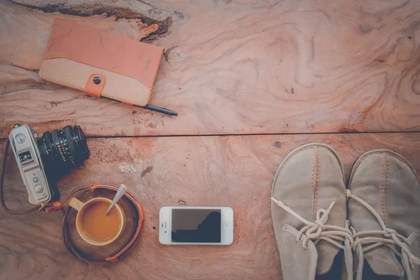 Camera Phones shoes on a wooden floor vintage.