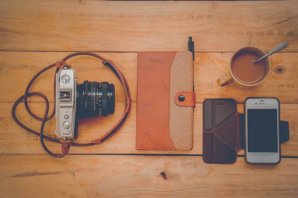 Camera Phones shoes on a wooden floor vintage.