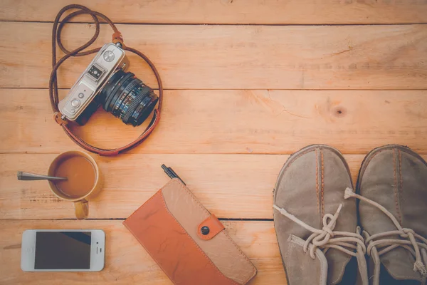 Camera Phones shoes on a wooden floor vintage.