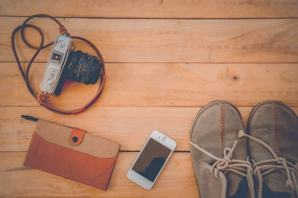 Camera Phones shoes on a wooden floor vintage.