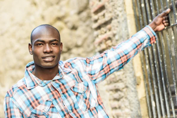 Black man wearing casual clothes in urban background