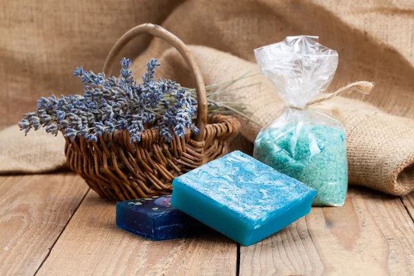Homemade Soap with Lavender Flowers and Sea Salt, on wooden back