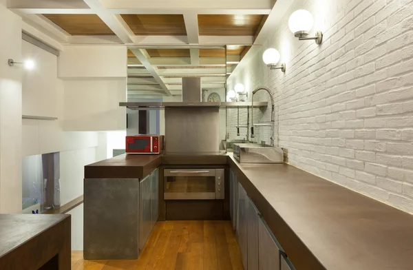 Interior, wide loft, domestic kitchen