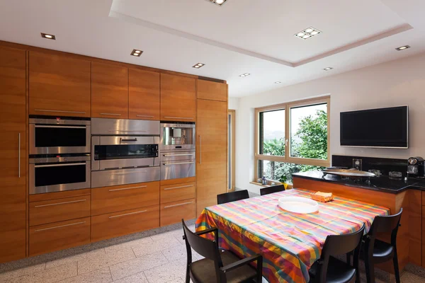Interior, wide domestic kitchen
