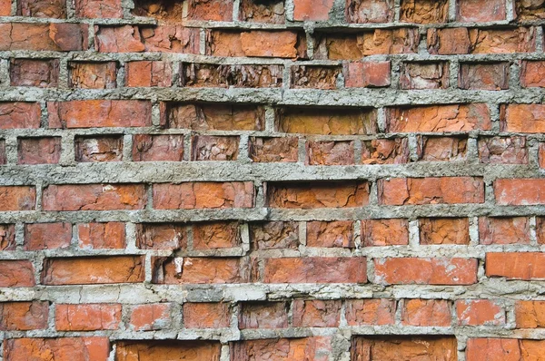 Old crumbling brick wall