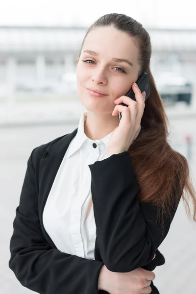 Business woman talking on the mobile phone