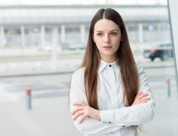 Confident business woman standing in office