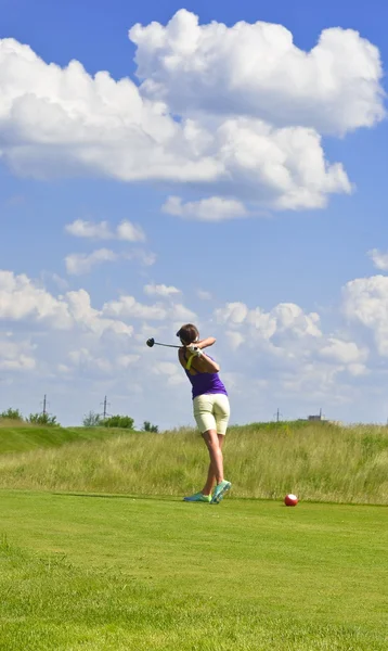 Woman Playing Golf on Golf Course