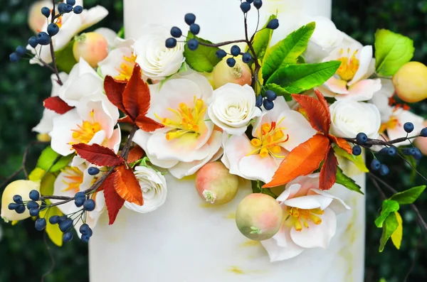 White wedding cake decorated with flowers