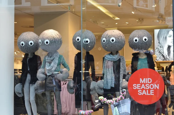 Female mannequins dressed in winter clothes on shop display