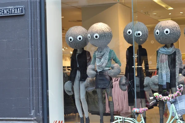 Female mannequins dressed in winter clothes on shop display
