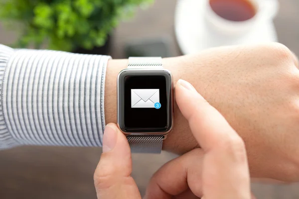 Man hand with smart Watch and mail on the screen
