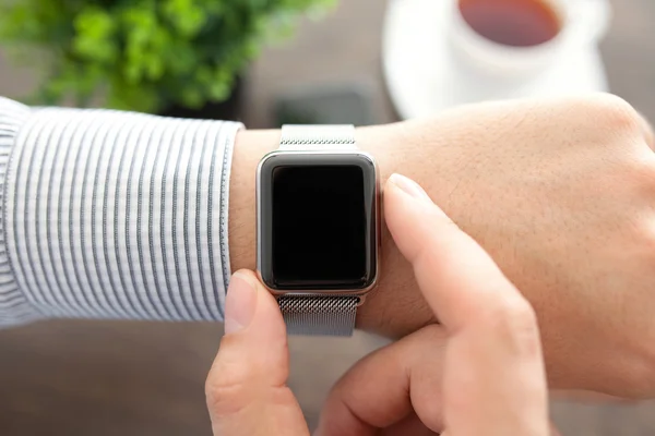 Man hands with smart watch in the office