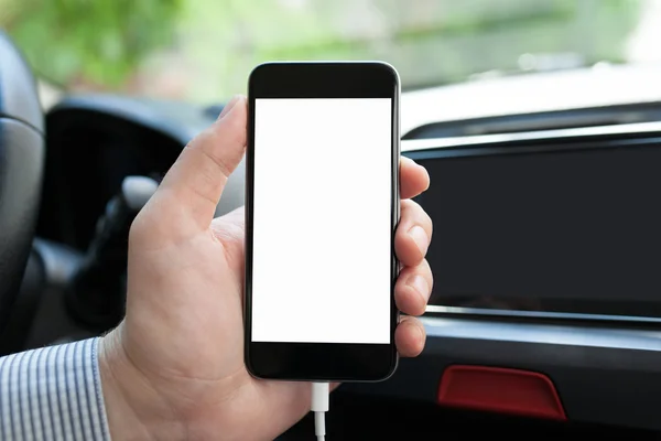 Man hand inside car holding phone with isolated screen