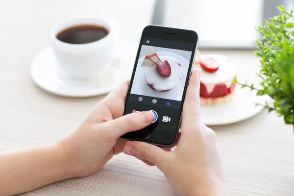 Woman holding iPhone 6 Space Gray with service Instagram