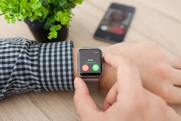 Man hand with Apple Watch and phone call on screen