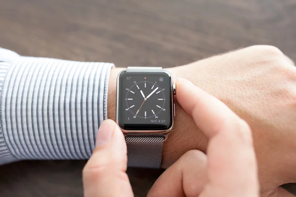 Man hand with Apple Watch on the desk