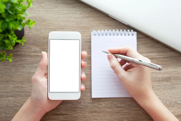 Female hands holding phone with isolated screen pen and notebook