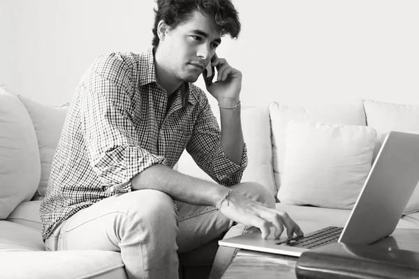 Businessman with laptop working at home