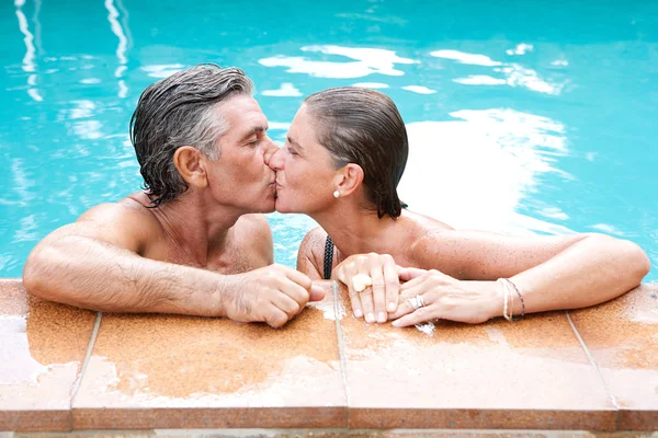 Couple kissing in a swimming pool