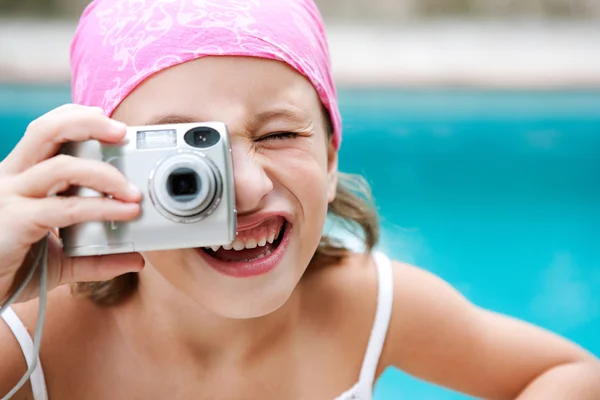 Girl using a digital photo camera