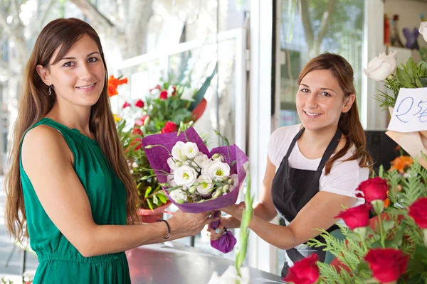 Woman buys a bouquet of flowers