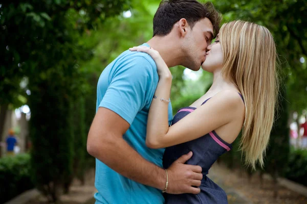 Romantic young couple kissing and embracing