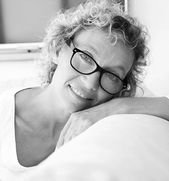 Portrait of mature woman relaxing at home