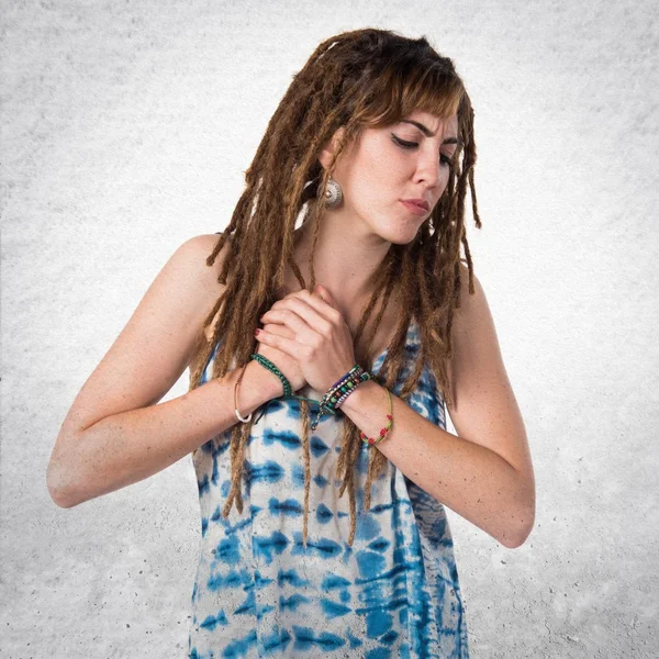 Girl with dreadlocks with heart pain