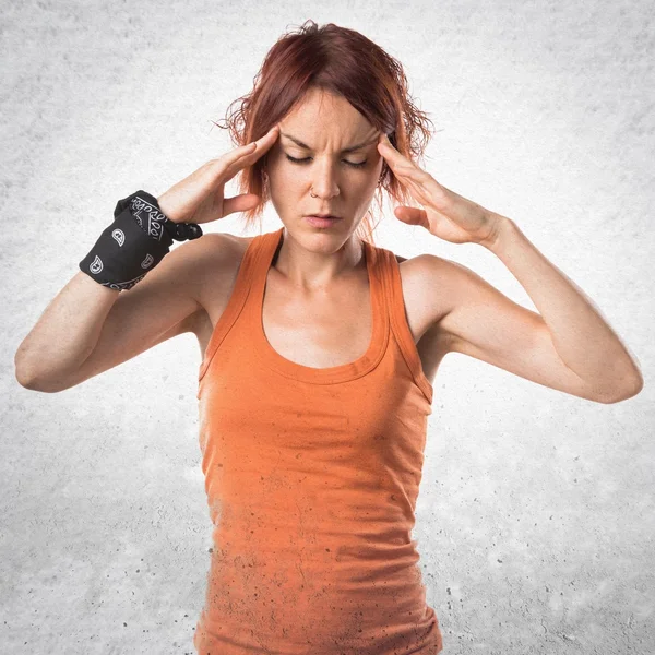 Frustrated woman over grey background