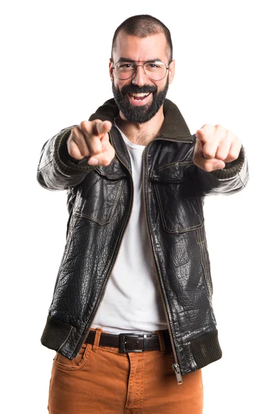 Man wearing a leather jacket pointing to the front
