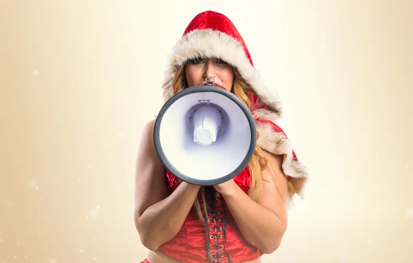 Christmas woman shouting by megaphone